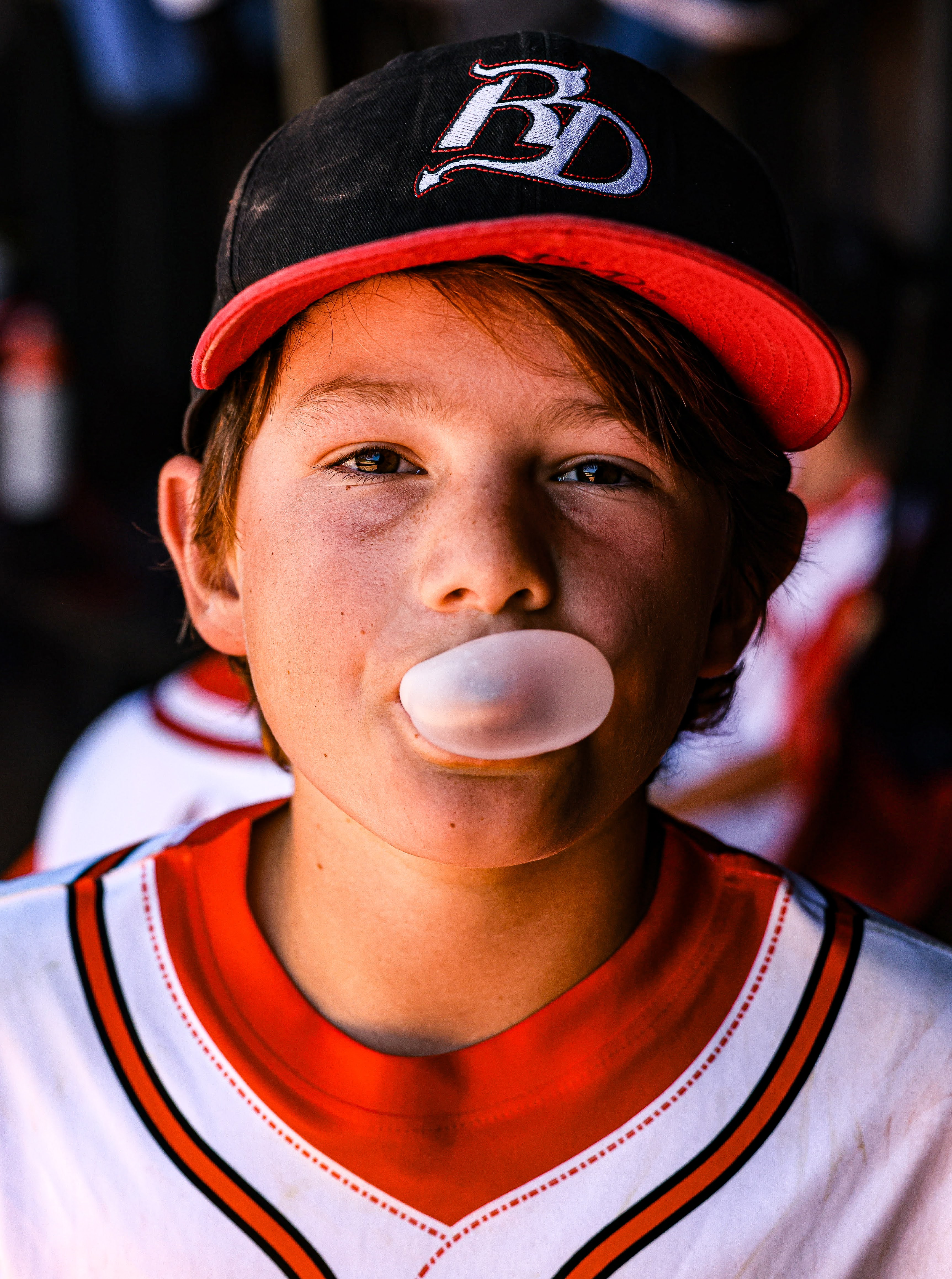 Red Devils player blowing bubble gum