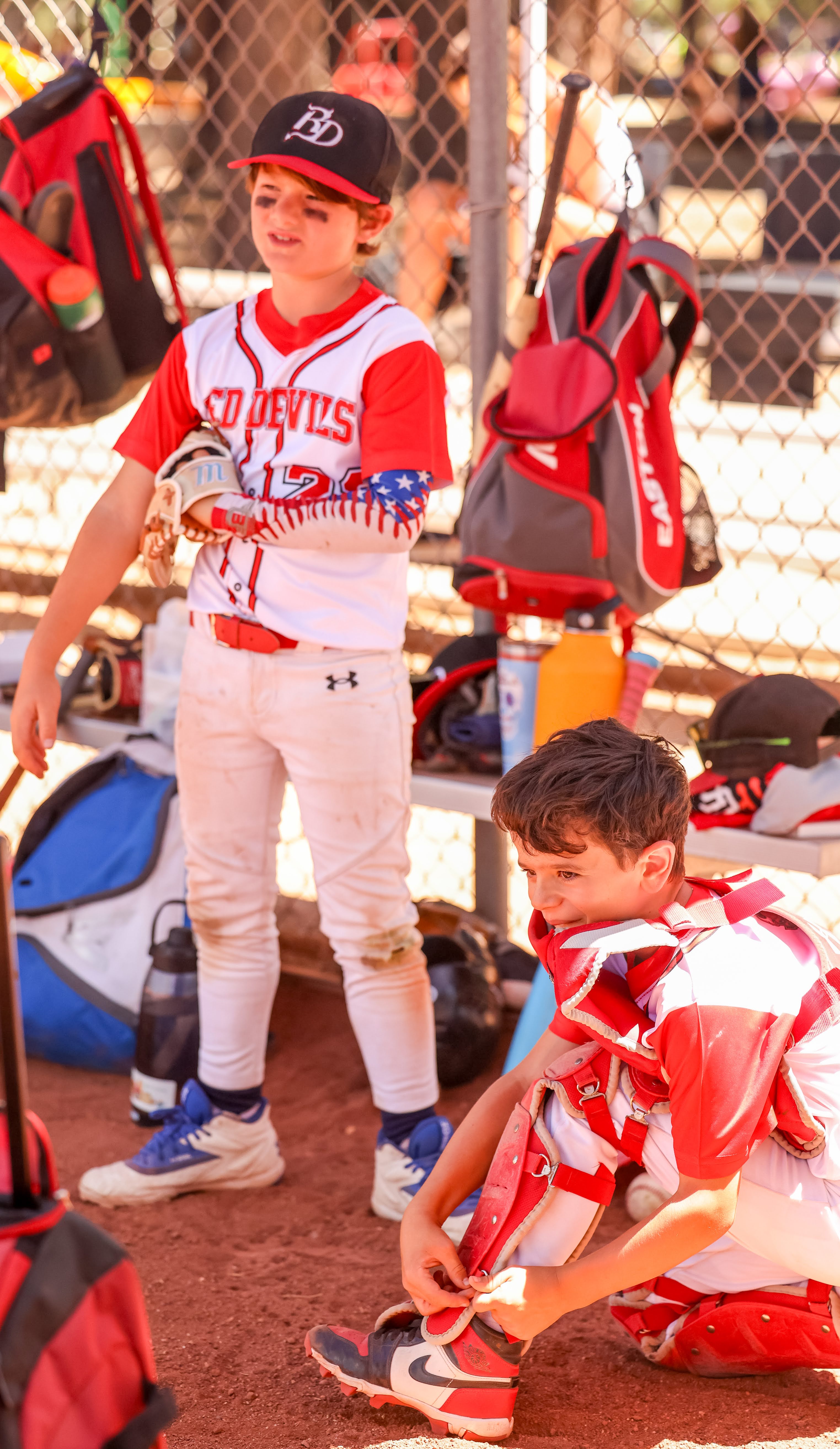 Red Devils player in the dugout