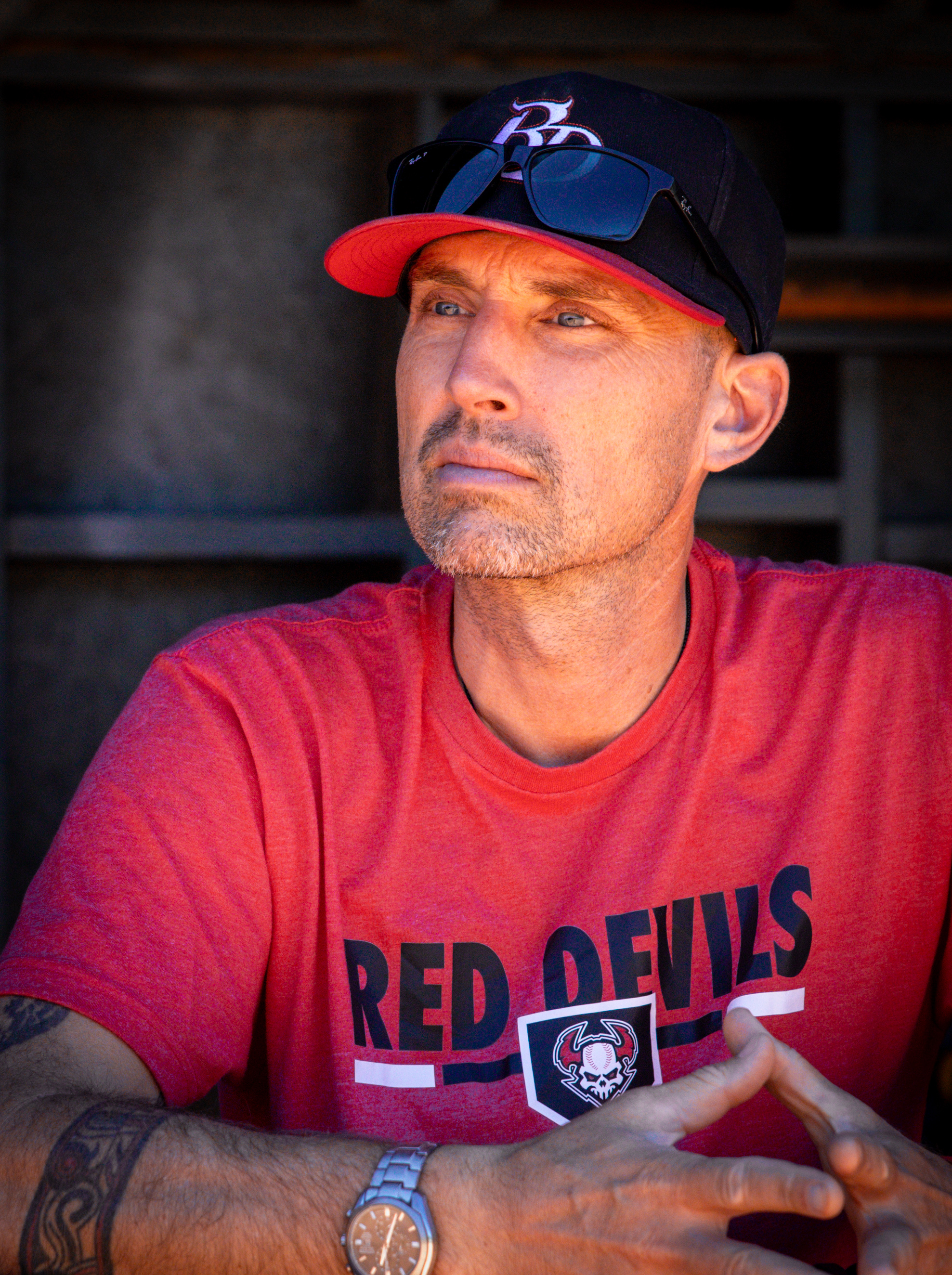 Red Devils coach in the dugout
