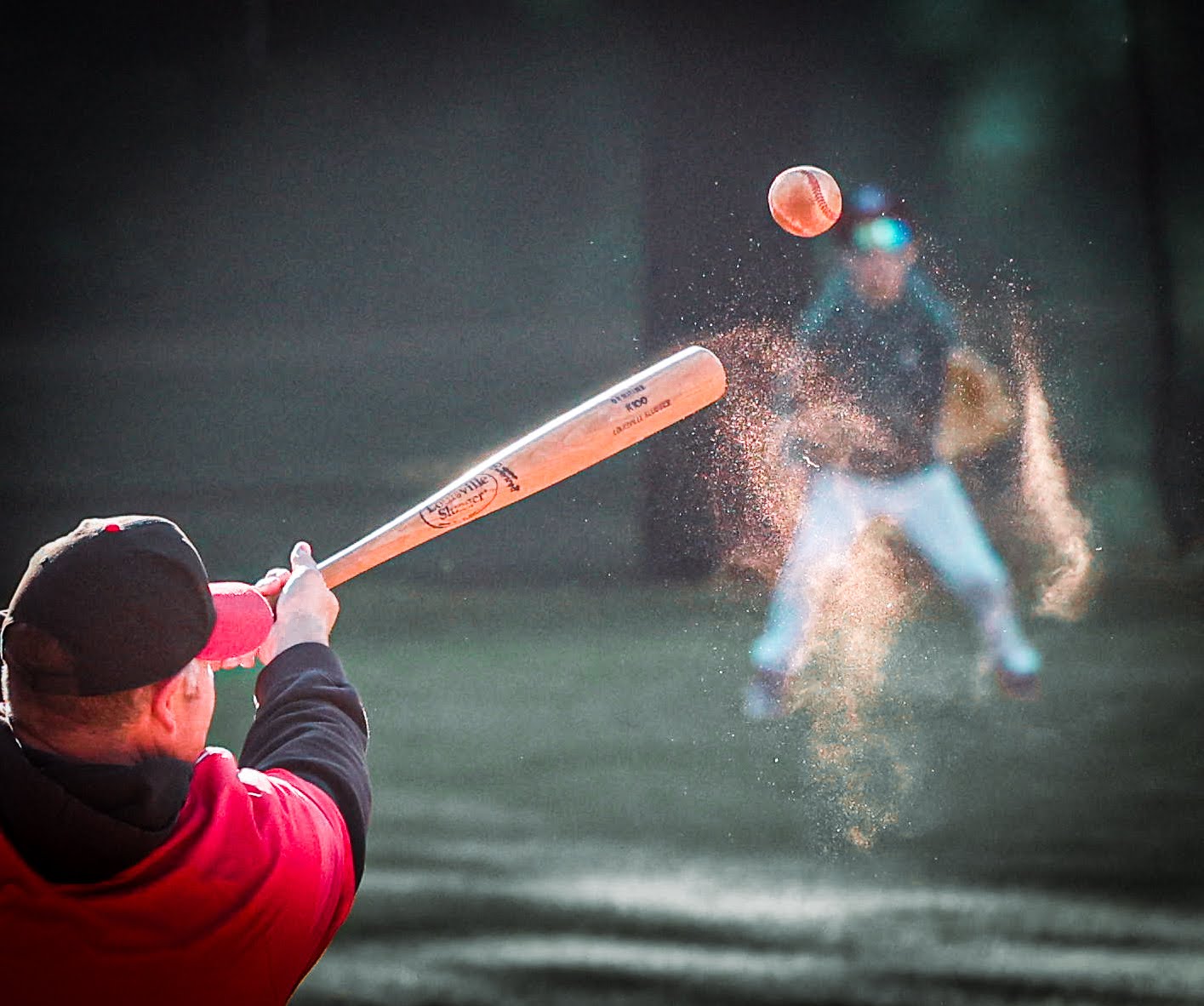 Red Devils coach hitting fungo